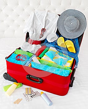 Travel suitcase packed for vacation