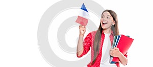 travel to france. learn foreign language. surprised teen girl hold french flag and workbook. Horizontal isolated poster