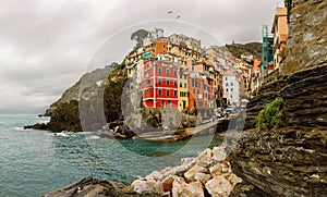 Travel to Italy: colorful houses Riomaggiore village on the cliff.