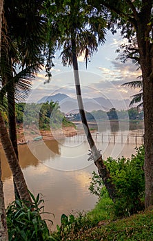Travel to Laos, Southeast Asia, view of the famous Asian Mekong River and bamboo bridge. Beautiful landscape and popular travel