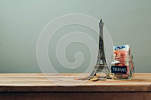 Travel to Paris, France concept with Eiffel Tower souvenir. Planning summer vacation