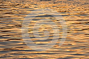 Travel to a portion of river with a natural scenery of sunset over a dock with lights photo