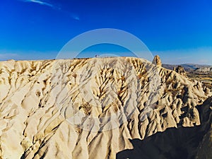 Travel to Turkey - above view of mountain valley with fairy chimney rocks in Goreme National Park in Cappadocia.