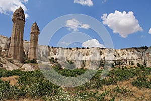 Travel to visit wonderful serie of troglodytes in love valley in blue sky, cappadocia, turkey