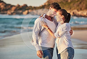 Travel, tourism and beach vacation with happy couple sharing hug, love and laughing while on holiday by the seaside