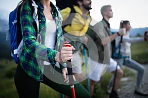 Travel, tourism, hike, gesture and people concept - group of smiling friends with backpacks