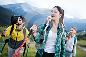 Travel, tourism, hike, gesture and people concept - group of smiling friends with backpacks