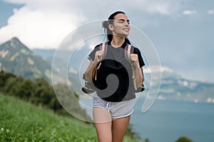 Travel and tourism. The Hiking. Woman in mountains. Woman hikers trekking in mountains. Young woman walking with