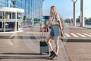 Travel tourist standing with luggages outdoor at international airport.