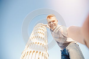 Travel tourists Man making selfie in front of leaning tower Pisa, Italy