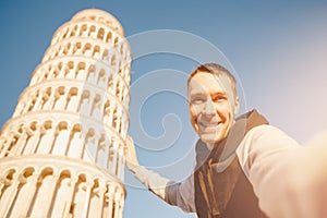 Travel tourists Man making selfie in front of leaning tower Pisa, Italy