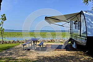 Travel trailer camping by the Mississippi river in Illinois photo