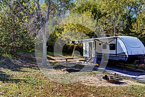 Travel trailer camping in the woods at Branched Oak Lake State Park, Nebraska