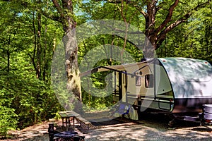 Travel trailer camping in the woods at starved rock state park photo