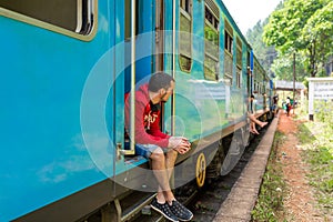 Travel by train in Sri Lanka. A very slow train with no doors. Picturesque places of the island