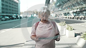 Travel, Travel, airport and excited lost woman with travel map used smart phone near a terminal airport. Backpack person