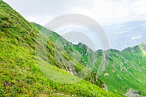 Travel, trekking, nature. Majestic, high green mountains. Horizontal frame