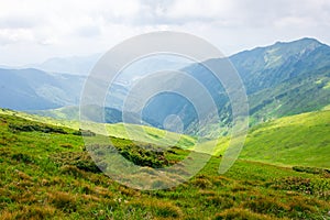 Travel, trekking, nature. Majestic, high green mountains. Horizontal frame