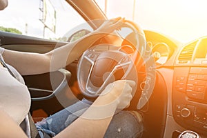 Travel trip car. Happy young woman inside vehicle driving in sunny day. Fun driver ride in summer vacation concept.