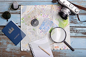 Travel and trip plan , tourism vacation mockup on a wooden table. Top view , summer accessories and items planning concept