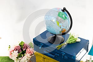 Travel or turism concept. Globe on vintage suitcases