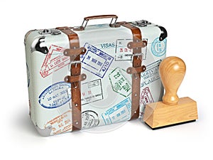 Travel or turism concept. Old suitcase with visa stamps isolated