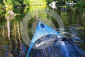 Travel and Vacation Ideas. Group of People Kayaking Outdoors On River
