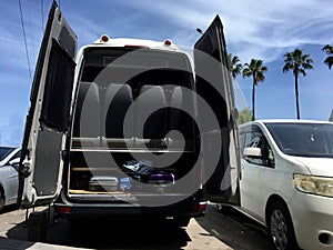 Travel van full of luggage leaving for holidays on a sunny day - traveling concept