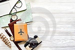 travel and wanderlust concept, planning summer vacation background flat lay, space for text. map compass photo camera sunglasses