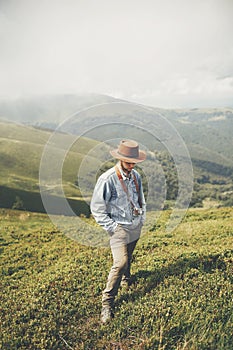 Travel and wanderlust concept. stylish traveler man standing on photo