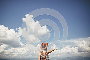 Travel and wanderlust concept. traveler hipster girl in hat stan photo
