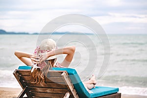 Travel woman with passport and plane on beach