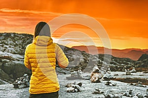Travel Woman walking enjoying sunset mountains