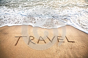Travel word on the beach