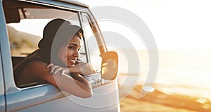 Travel, you deserve it. an attractive young woman enjoying a road trip.