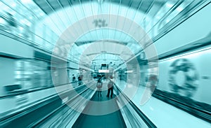 Travelator with passengers in airport