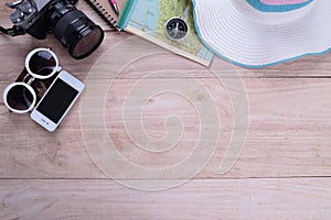 Traveler accessories Go on an adventure on a wooden background