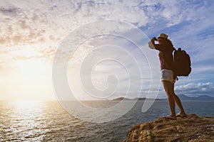 Traveler asia woman on sea cliff