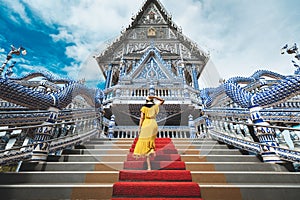 Traveler asian woman with dress travel in temple Thailand