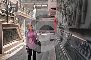 Traveler asian woman enjoying a looking at wenwu temple place, taiwan