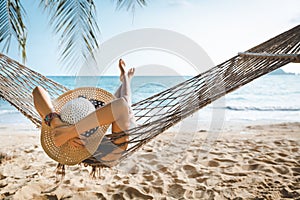 Traveler asian woman relax in hammock on summer beach Thailand