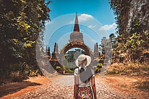 Traveler asian woman relax and travel in temple at Khao Na Nai Luang Dharma Park Surat Thani Thailand