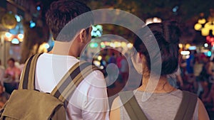 Traveler backpacker Asian couple travel in Bangkok, Thailand, sweet couple drinking alcohol or beer while hangout at The Khao San