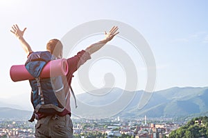 Traveler backpacker in front of a city destination