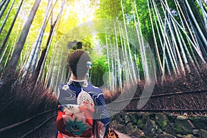 Traveler in Bamboo Forest Grove, Kyoto, Japan