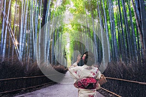 Traveler in Bamboo Forest Grove, Kyoto, Japan