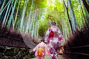 Traveler in Bamboo Forest Grove, Kyoto, Japan