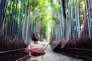 Traveler in Bamboo Forest Grove, Kyoto, Japan