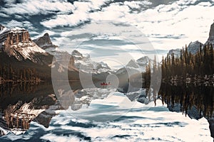 Traveler canoeing in Spirit Island with Canadian Rockies on Maligne lake at Jasper national park