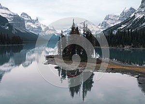 Traveler canoeing in Spirit Island on Maligne Lake at Jasper national park